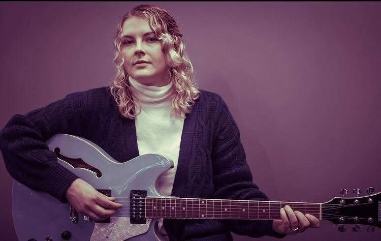 Tyler Wallin playing guitar
