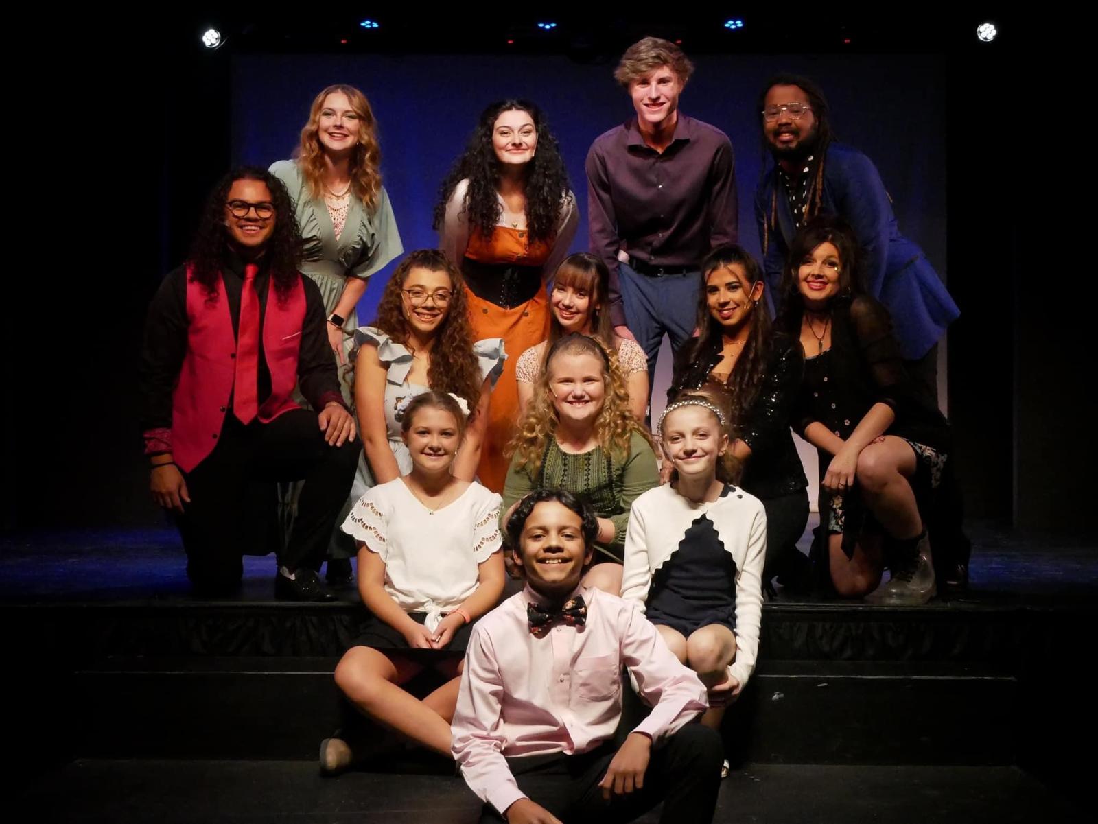 Tyler Wallin with a theatre cast